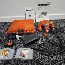 orange 🍊 Nintendo 64 console with orange controller and 2 unbowed games 

comes with power cable and hdmi adapter 

tested fully working