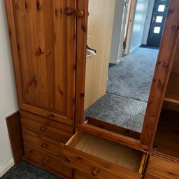 Large solid pine wardrobe with 9 drawers and two rtall cupboards. Plenty of storage solution