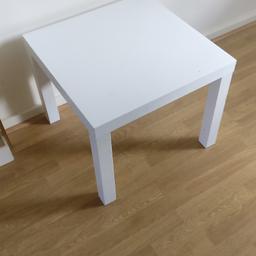 Small white side table or coffee table.

Kept in good condition