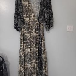 Ladies wrap dress from Next. Size 12. Elasticated waistband to back of dress, ties at the side. Only worn once. Excellent condition from a smoke free home. Collection from FY1 6LJ