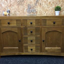 Solid oak sideboard. A lovely piece of heavy quality furniture built to last. It has plenty of storage space inside with 6 x dovetail storage drawers & 2 x cupboards each with an adjustable/removable shelf inside. The unit measures 140cm wide x 45cm deep x 85cm tall. Viewing/collection is Leeds LS24 & delivery is available if required - £195