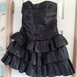 Black boned strapless dress with frills from LIPSY
ONLY WORN ONCE 
In excellent condition 
FROM SMOKE & PET FREE HOME 
LISTED ELSEWHERE 
COLLECTION B31 OR B32 OR B14