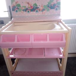 Pink and cream baby changing unit with bath and storage good condition only used a few times.