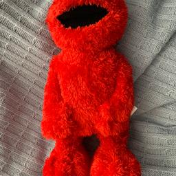 In fantastic condition a lovely rare find TICKKE ME ELMO sells for £35 on eBay 
Giggles and bends over when laughing.