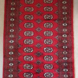 Beautiful Hand Knotted Pakistan Handmade Bokhara Rug traditional 'elephant's foot' pattern in red. Length 162cm Width 96cm Depth 1cm. The feel of the wool is soft and velvety with a hard wearing dense pile. Rug has been used but is in good condition. Bought from John Lewis where similar rugs are now priced £350. This is a real BARGAIN for a high quality item. Price includes UK mainland delivery and insurance.