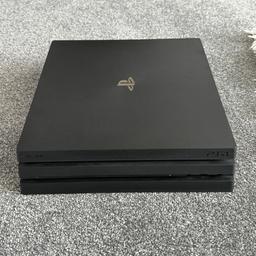 Playstation 4 Pro console in good condition, very little wear and tear. Comes in original inner box (outer box with logos etc. missing) with AC adapter, HDMI cable, USB charging cable for controller, and two controllers (one original black and one blue). Unopened copy of Overwatch. Manuals also included.