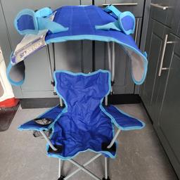 Brand new child's camping/garden chair with canopy shade. fold together so can be carried like a back pack.