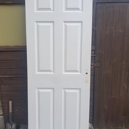 White internal 6 panel door, painted, 76x196.5cms sanded halfway down lock side which hook hole on rear