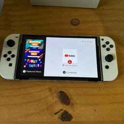 Nintendo Switch Oled in good condition comes with the dock, Charger, and hdmi cable,wheel for the joy con for Mario and the 2 hand grips for the joy cons, also comes with a wired controller, all works perfect