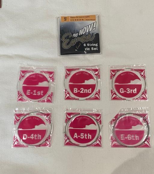 Buy & Sell Shropshire Telford and Wrekin - Photos for Encore Guitar strings pack of 6 + plectrum