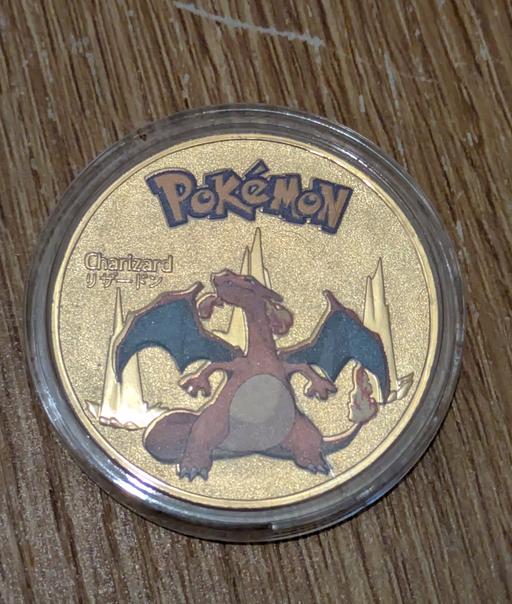 Buy & Sell Southend South East London - Photos for Commemorate Gold Charizard Pokémon coin