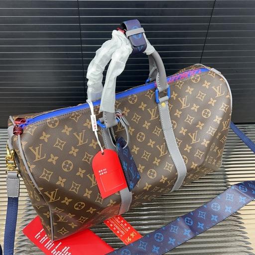 Buy & Sell Leatherhead Mole Valley - Photos for Brown and Blue Louis Vuitton duffle bag + tag