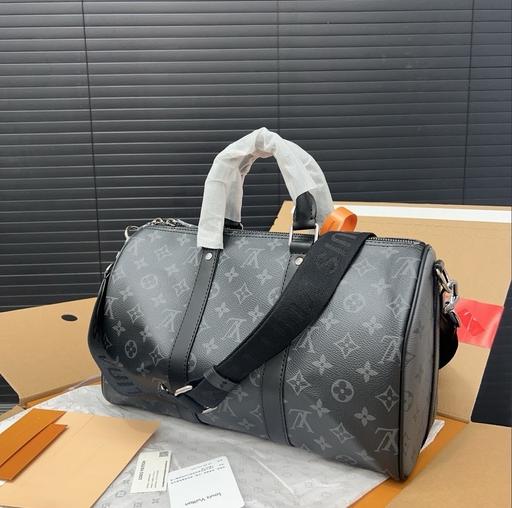 Buy & Sell Leatherhead Mole Valley - Photos for Black Louis Vuitton duffel bag with tags etc