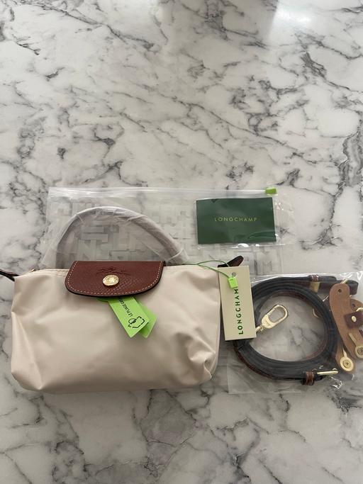 Buy & Sell Upper Edmonton North London - Photos for Longchamp Le Pilage Cream Pouch Bag