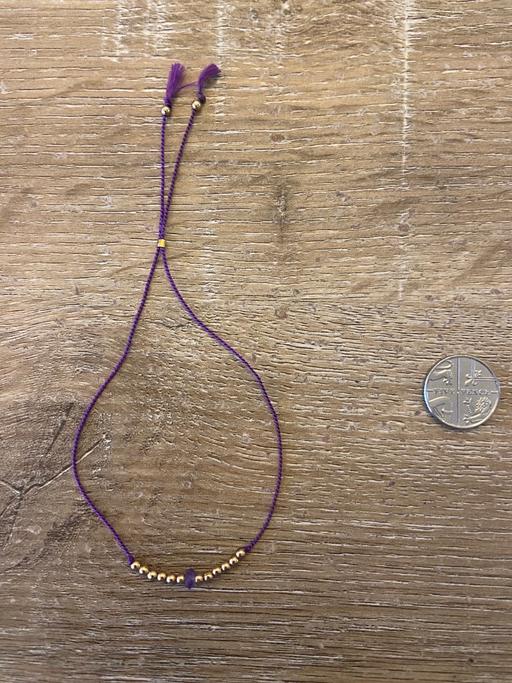 Buy & Sell Wandsworth South West London - Photos for Pretty purple silk thread bracelet.Gold beads