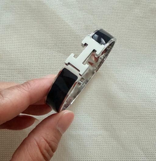 Buy & Sell Bowes Park North London - Photos for Silver plated stainless steel black H bangle