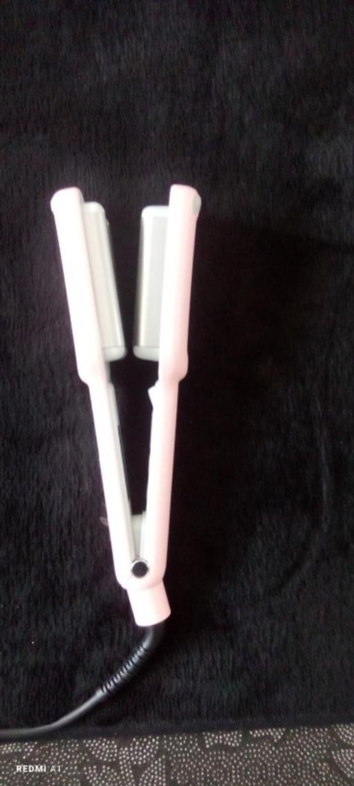  — Curling iron