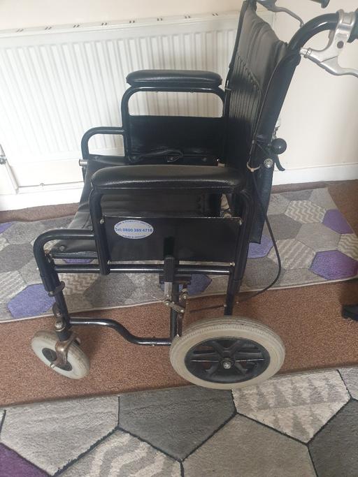  — Foldable Wheelchair with Carrying Handles.