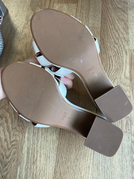  — Sandles