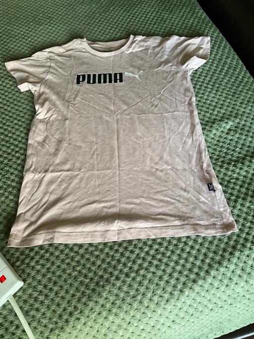  — PUMA TOP