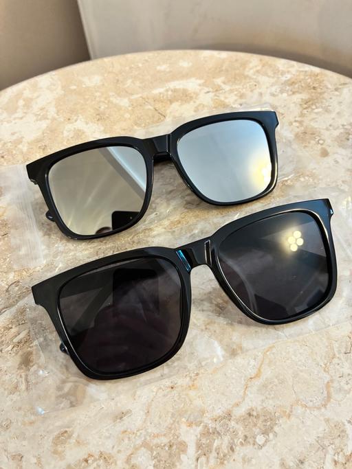  — 2x sunglasses