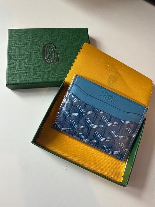  — Card Holder