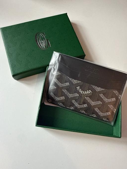  — Card Holder
