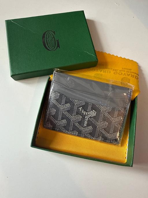  — Card Holder
