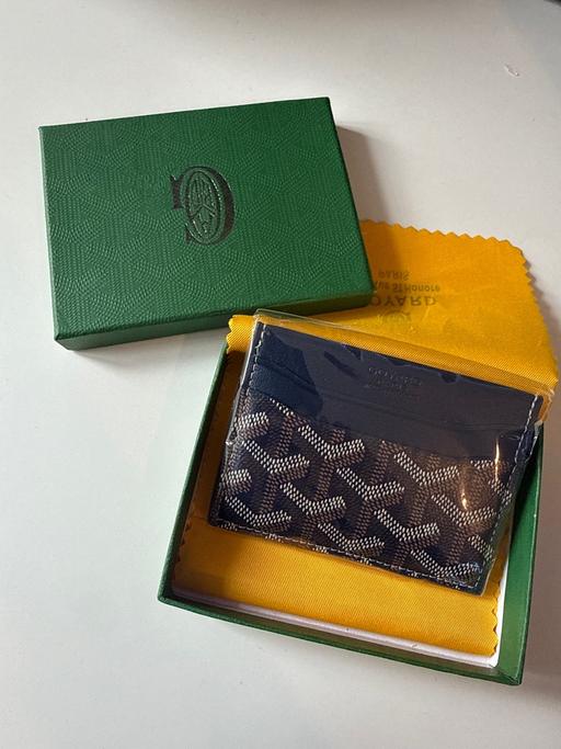  — Card Holder