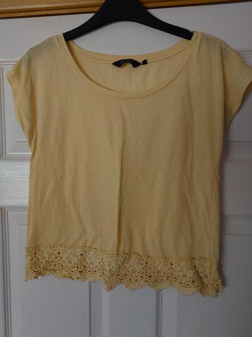  — Women's yellow top size 8