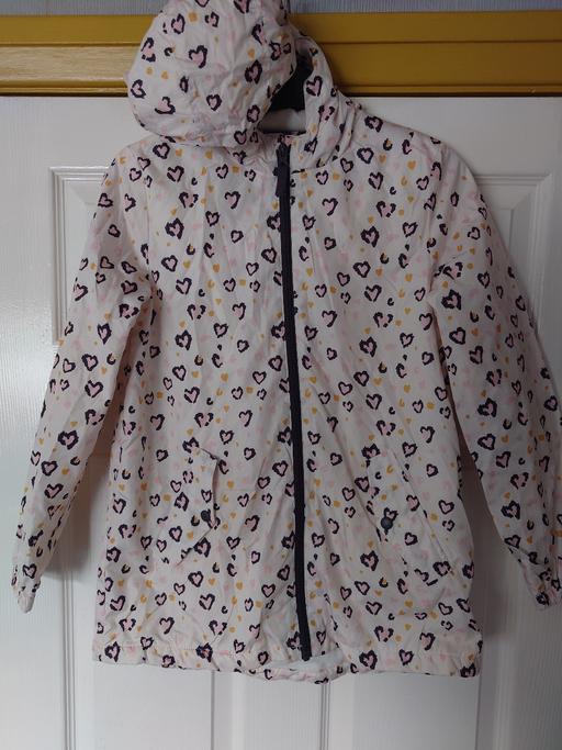  — Girls white patterned coat size 11-12 years
