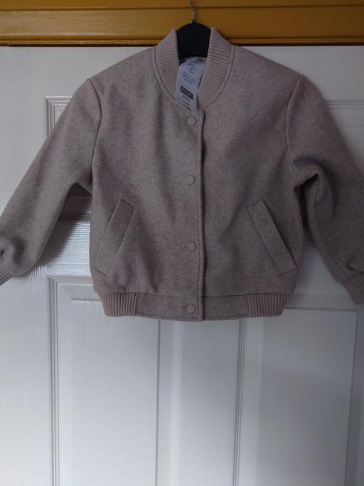  — Girls light brown jacket size 6-7 years