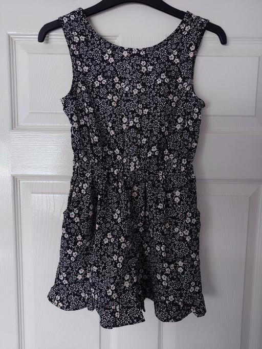  — Girls floral playsuit size 8 years