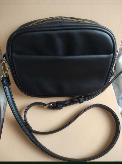  — Black purse