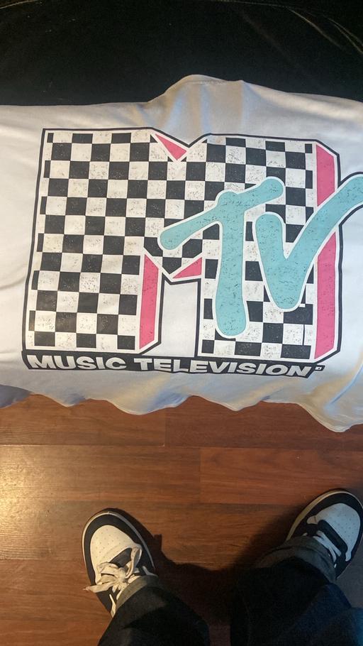  — Two new T-shirts with tags, medium