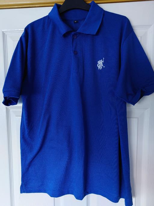  — Mens blue polo top size XL