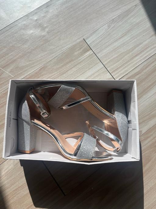  — Sparkly silver high heels