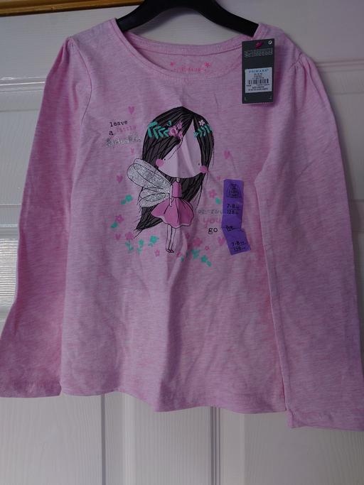  — Girls pink long sleeved top size 7-8 years