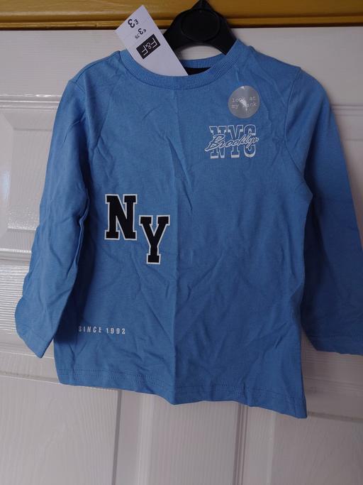  — Boys blue long sleeved top size 18-24 months