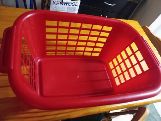  — Red plastic laundry basket