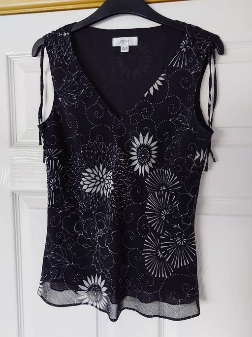  — Women's black sleeveless top size 10