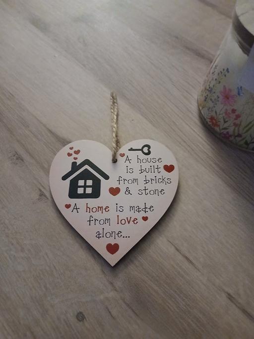  — Plaque New