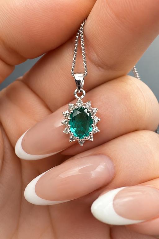  — 9ct White Gold Emerald and Diamond Pendant