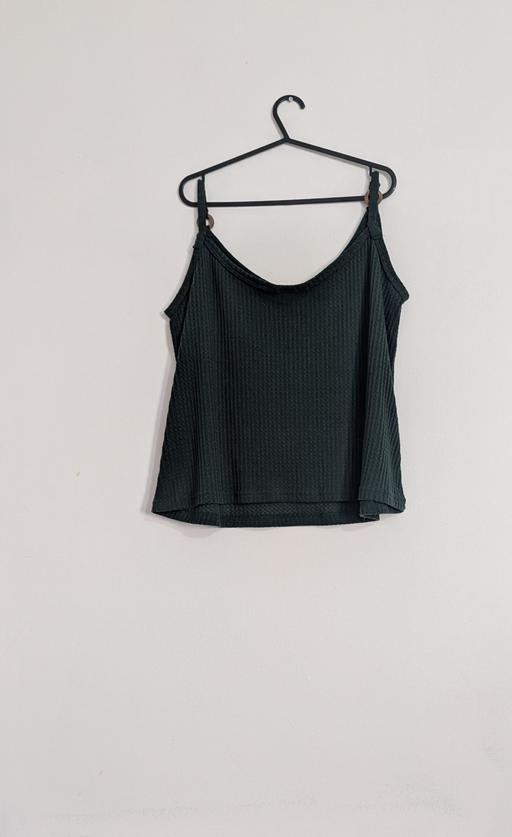  — green vest top