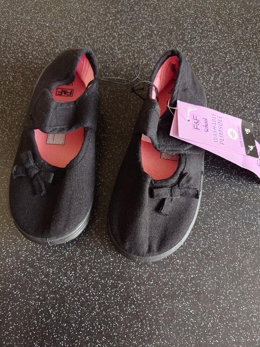  — Girls black plimsolls size 9