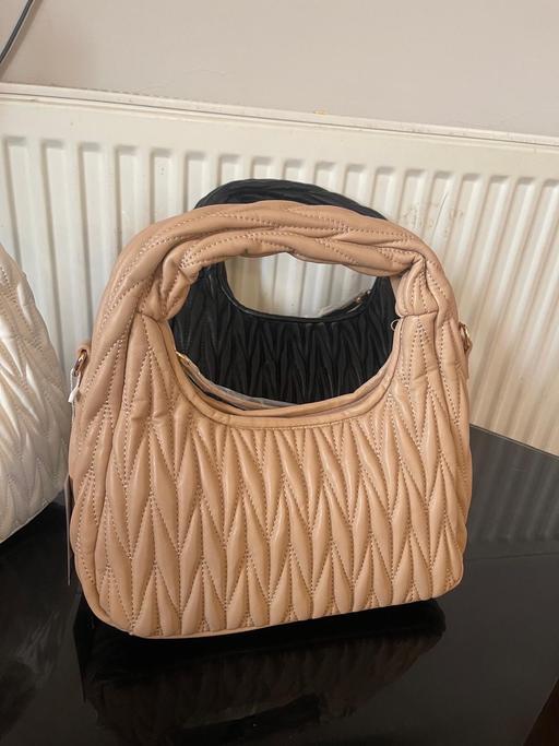  — Handbag