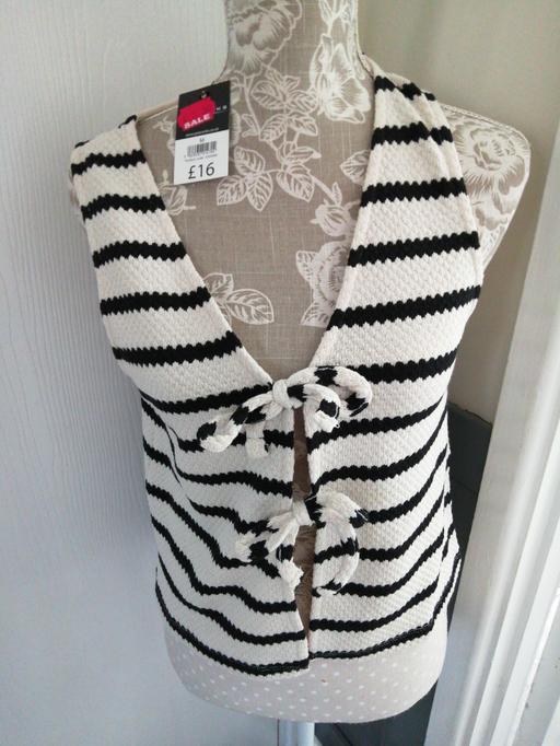  — ladies size *M*  Peacocks