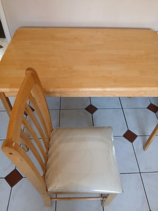  — Solid wooden table & 3  chairs