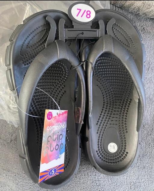  — Black flip flops size 7-8