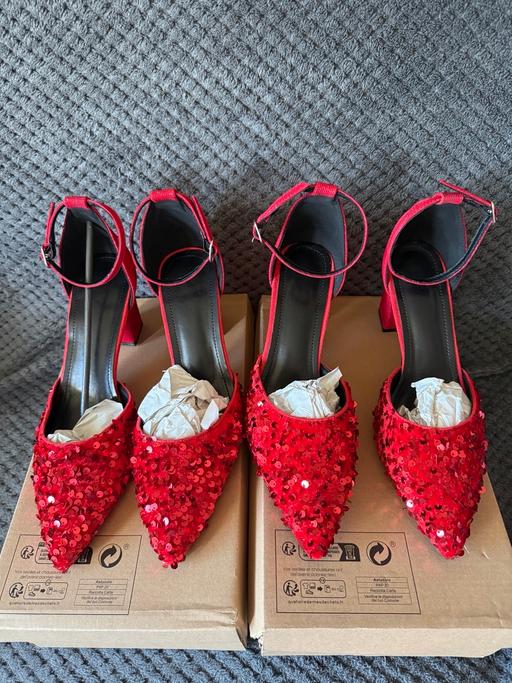 — Women’s red sequin shoes.